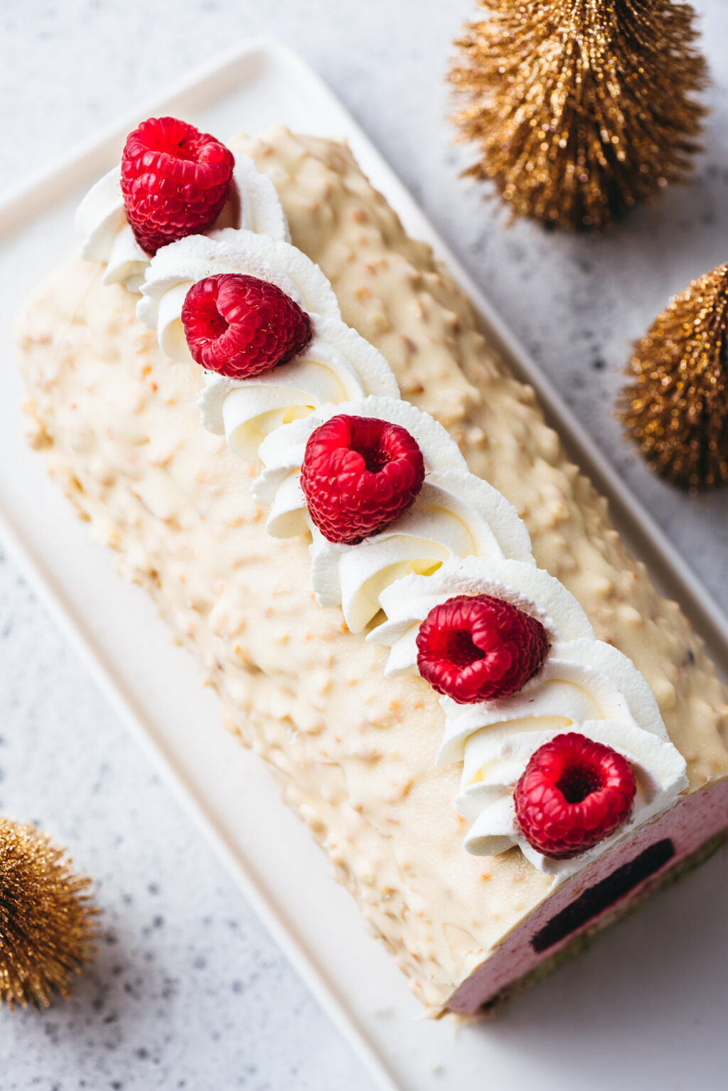 Bûche de Noël glaçage rocher chocolat blanc - Lilie Bakery